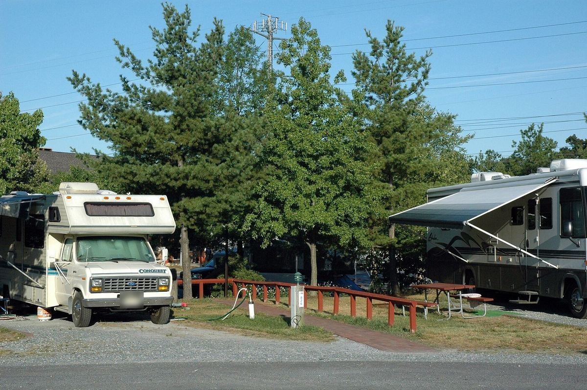 Two motorhomes on their sites at Cherry Hill Park campground in Beltsville, Maryland